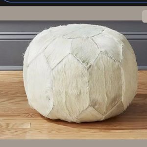 CB2 white hair on hide pouf